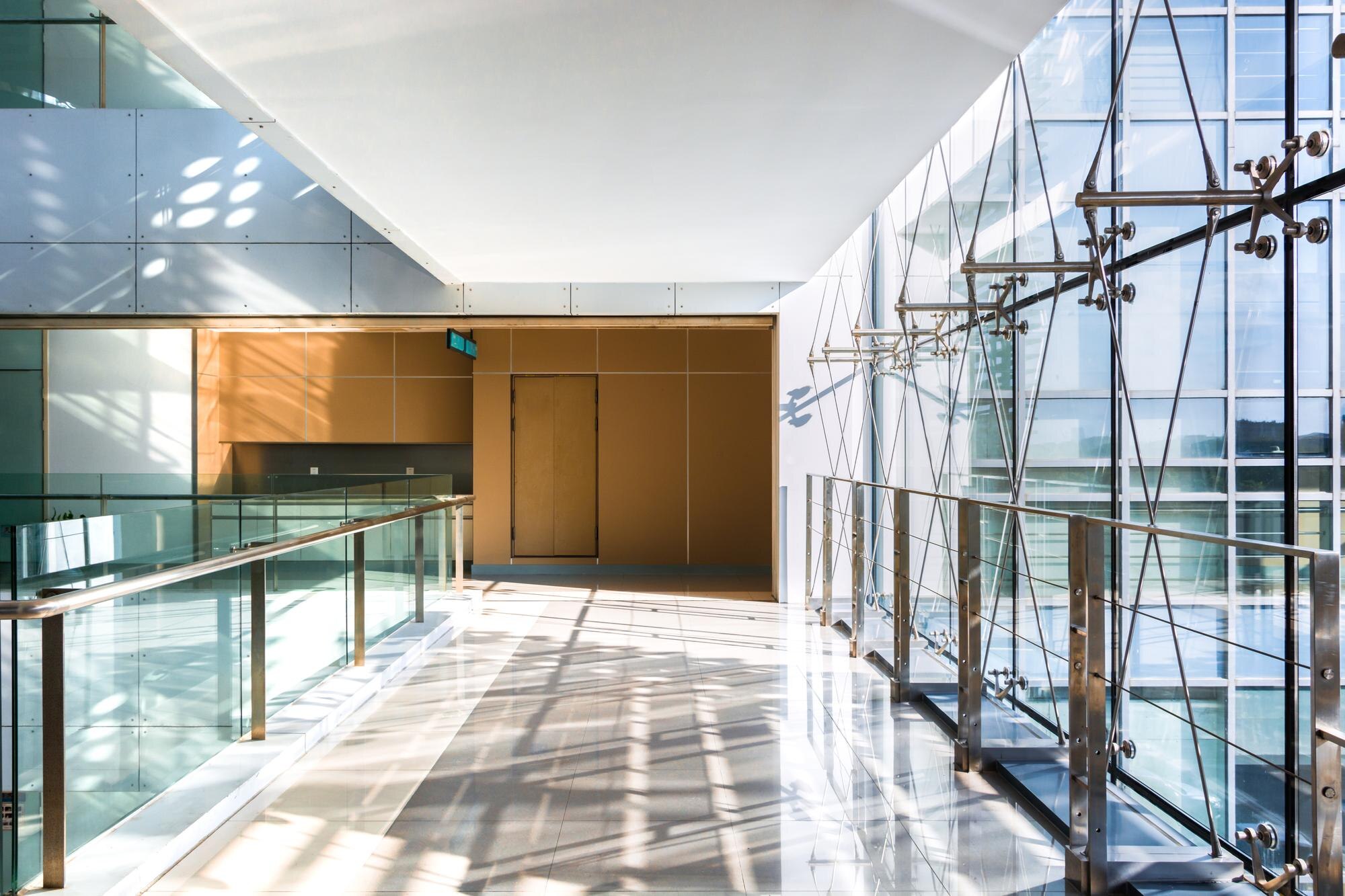 A bright, empty hall in a modern office building